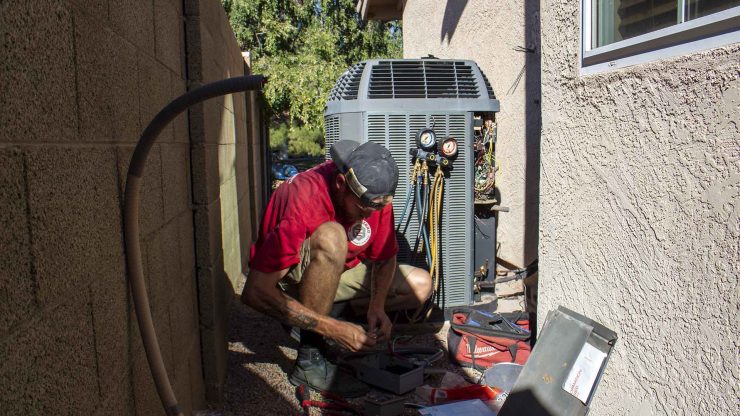 tech finishing up ac charge test