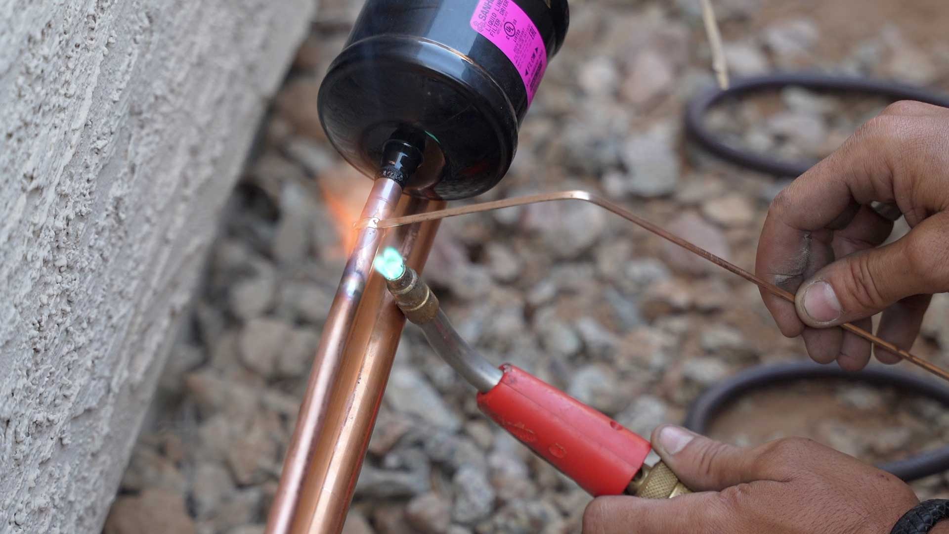 Queen Creek HVAC tech. Solders HVAC lines